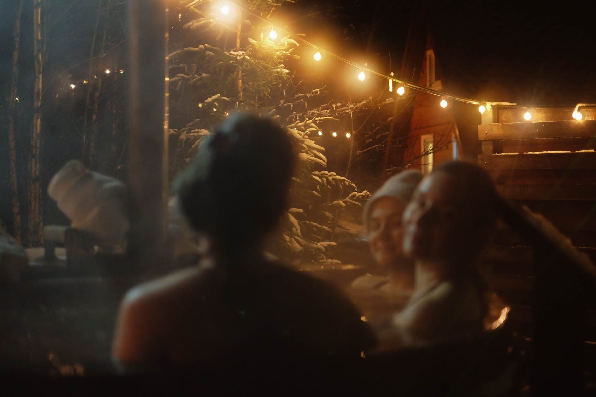 An outdoor hot tub steaming gently in cool evening light