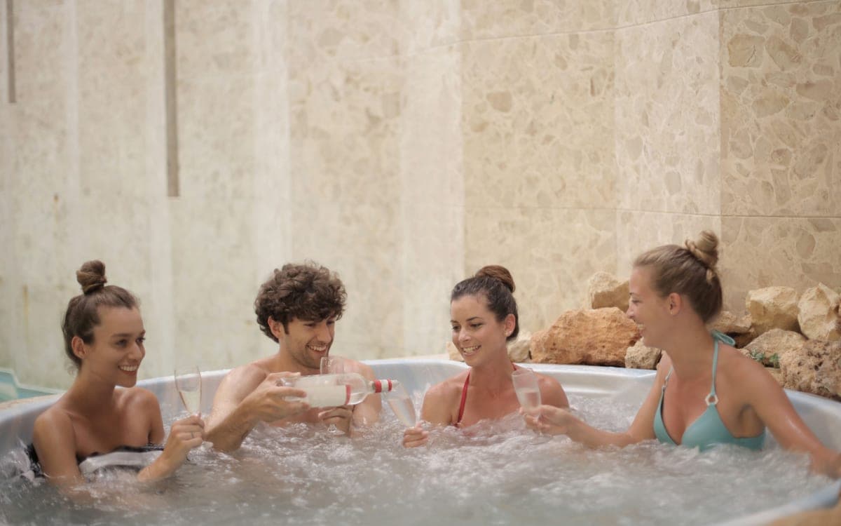 The surface of heated spa water catching low daylight